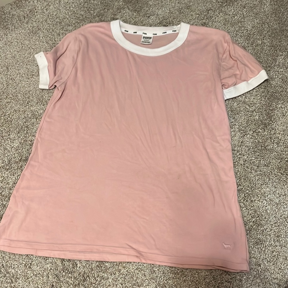 Victoria’s Secret pink t-shirt, with white trimmed sleeves and collar